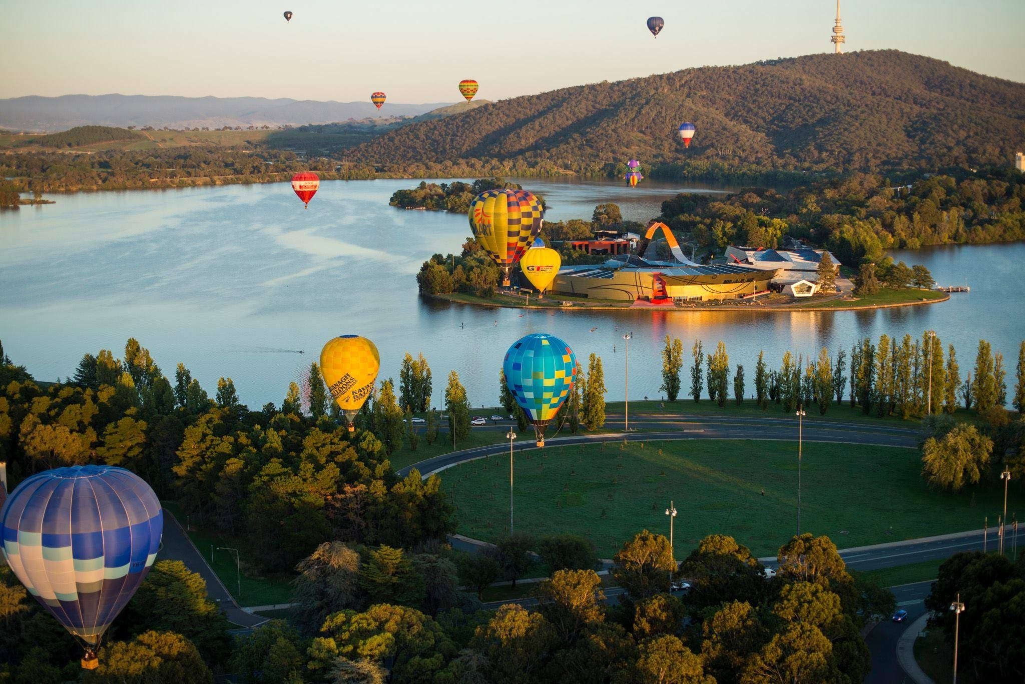 Hot air balloons floating above Luke Burley Griffin © Martin Ollman