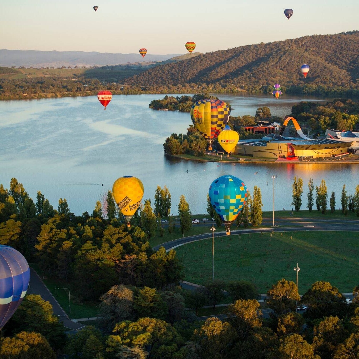 Hot air balloons floating above Luke Burley Griffin © Martin Ollman