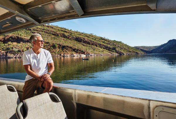 Man on a boat cruise on Lake Argyle in the Kimberley region © Tourism Western Australia