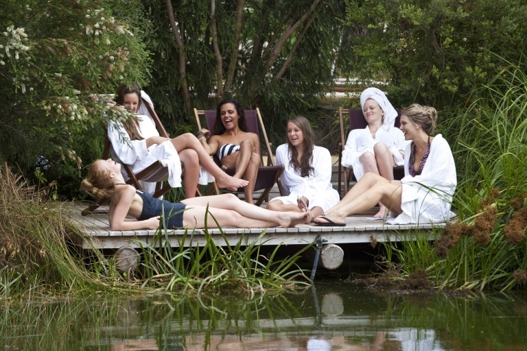 Girls Group relax lakeside at Peninsula Hot Springs, Mornington Peninsula VIC © Visit Victoria