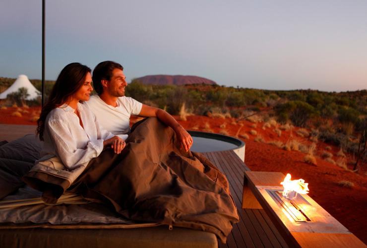 Visitors in a swag on the dune pavilion terrace at Longitude 131 in Yulara © Tourism NT/Julian Kingma