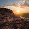 Man standing on the top of the rock in Ubirr, Kakadu National Park © Tourism NT/Daniel Tran9