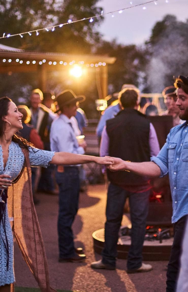 A group of friends playing cricket on the sand at Coledale Beach, Thirroul, New South Wales © Destination NSW 