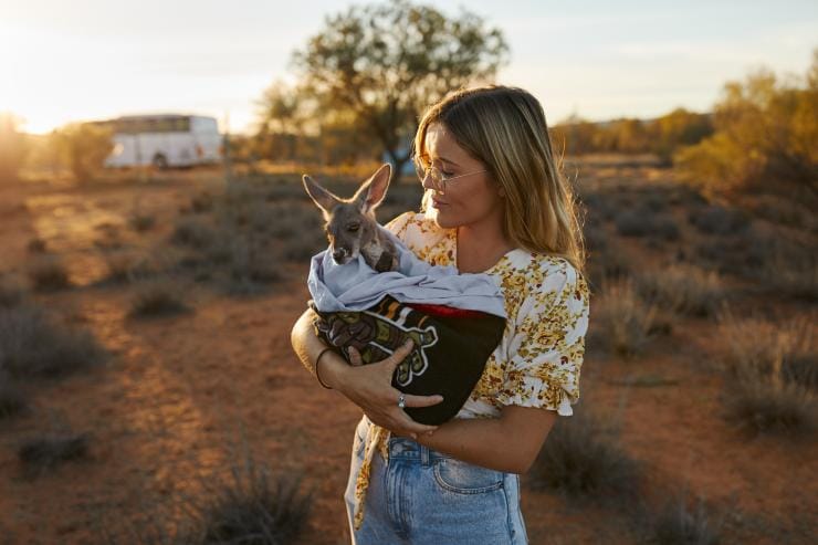 Holding a Baby Kangaroo at The Kangaroo Sanctuary © Tourism NT/Matt Cherubino