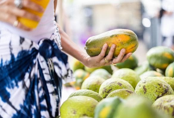 Woman holding fresh produce at Parap Markets, Darwin, Northern Territory © Tourism Events NT/Helen Orr
