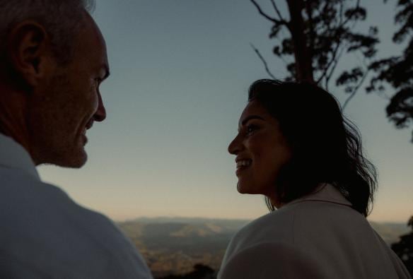 A man and woman looking at each other, Tamborine Mountain, Queensland © Reveling