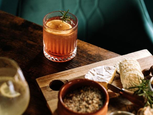 Cocktail and plate of cheese and crackers at Ladbroken Distilling Co, Tumbarumba, New South Wales © Ladbroken Distillery Brewhouse