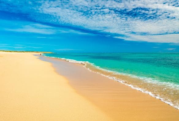 A golden sand beach with bright turquoise water at Mauritius Beach, near Exmouth, Western Australia © Tourism Western Australia