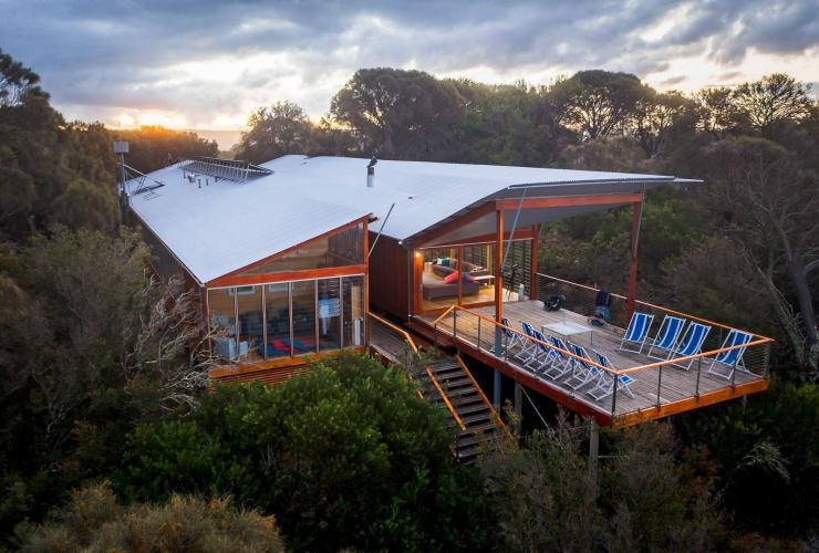 Aerial view over a lodge tucked within bushland, Bay of Fires Signature Walk, Bay of Fires Conservation Area, Tasmania © Tourism Australia