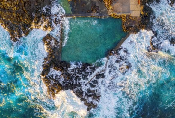 Aerial overlooking Blowhole Point Rock Pool, Kiama, New South Wales © Destination NSW