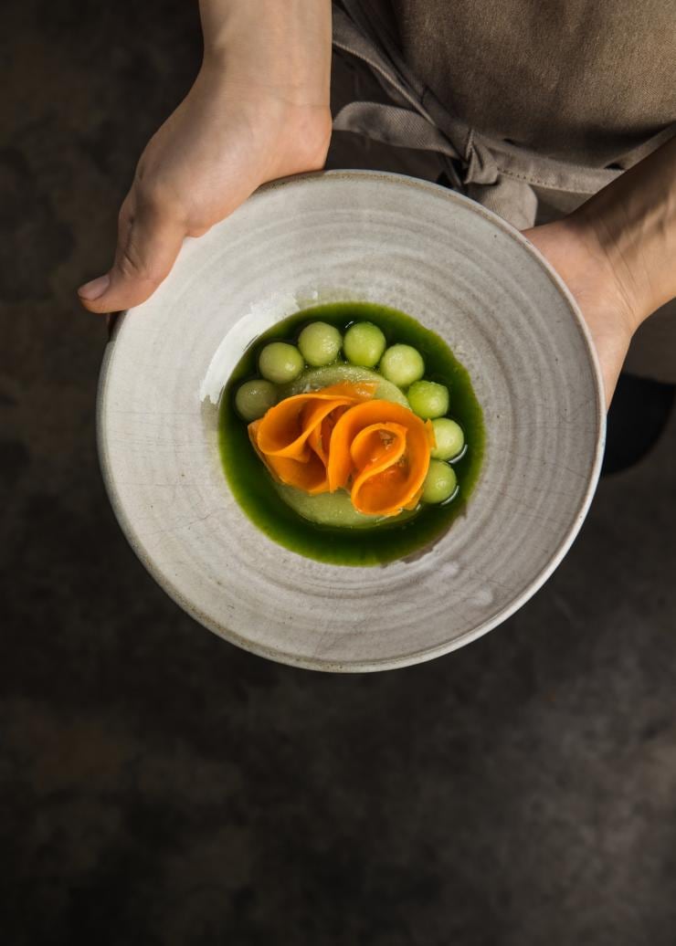 Waiter holding an innovative dish at Mt Lofty Ranges Vineyard, Adelaide Hills, SA © South Australian Tourism Commission