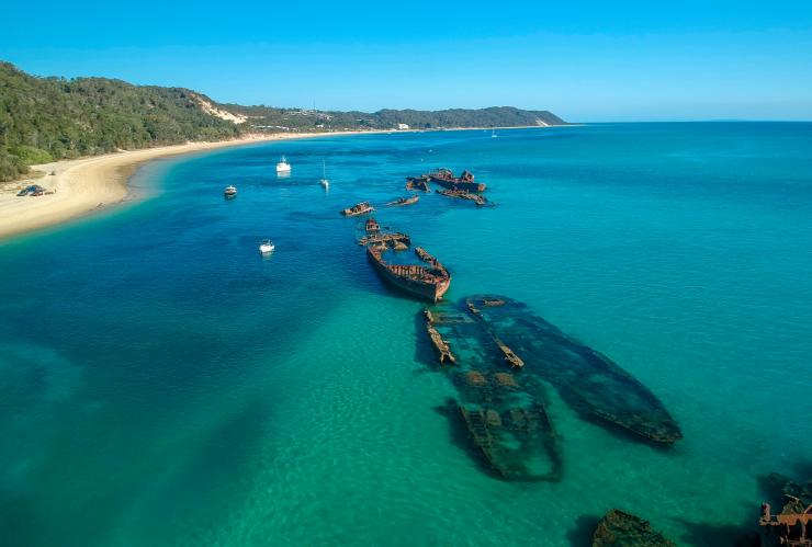 A shipwreck just off the shore from an island, Dolphin Research Expeditions, Moreton Bay, Queensland © Tourism Australia