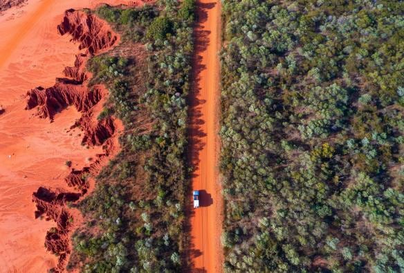 Aerial view of a red dirt road at James Price Point, Kimberley, Western Australia © Tourism Australia