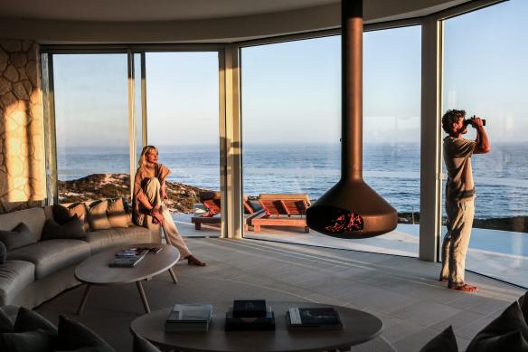 Two people take in the expansive views in their room at Southern Ocean Lodge in Kangaroo Island, South Australia © Tourism Australia