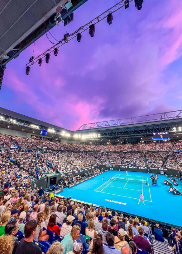 A tennis court surrounded by a crowd of people at Melbourne Park, Melbourne, Victoria © Tourism Australia