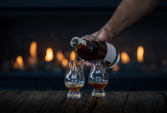Pouring whisky in glasses, Hellyers Road Distillery, North West Tasmania, Tasmania © Jess Bonde