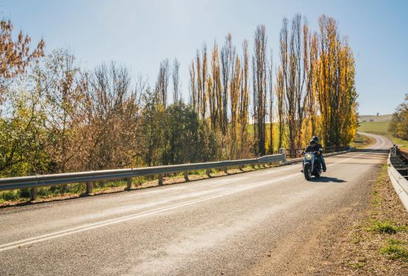 Motorcyclist enjoying a scenic drive along the Snowy Valleys Way, Tooma in the Snowy Mountains, New South Wales © Destination NSW