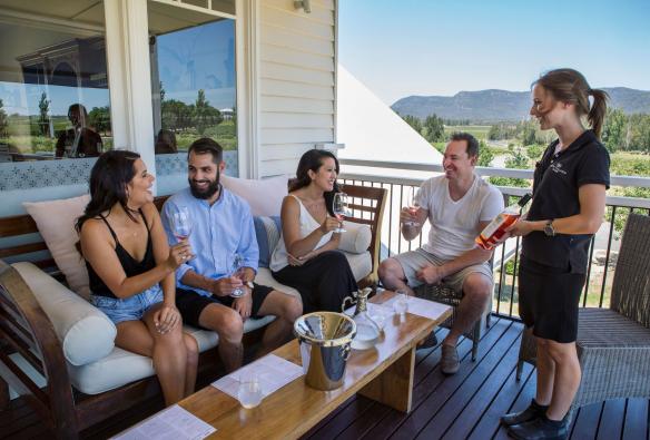 Friends enjoying a wine tasting at Keith Tulloch Wine, Pokolbin in the Hunter Valley, New South Wales © Destination NSW