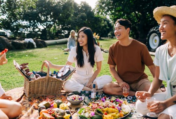 Friends enjoying a picnic at Tropical Fruit World, Duranbah, New South Wales © Destination NSW