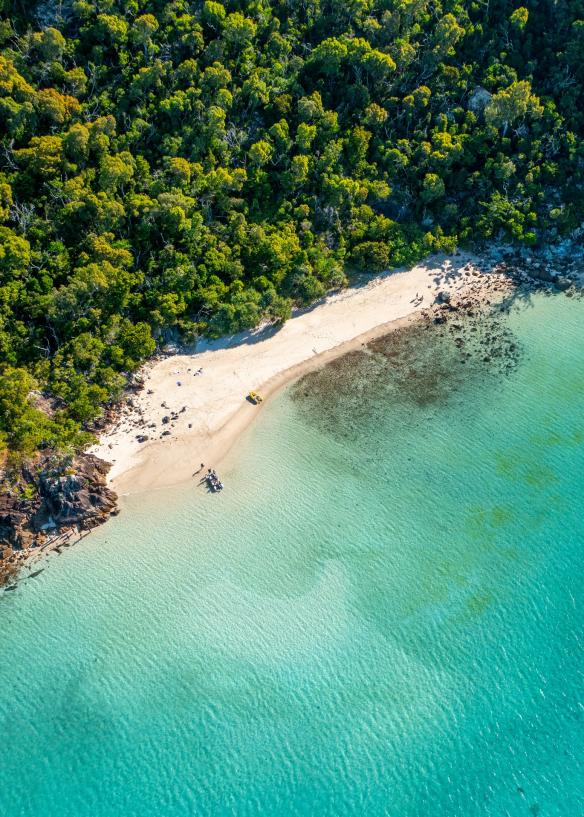 Aerial of a white sand beach in the Whitsundays, Queensland © Tourism and Events Queensland