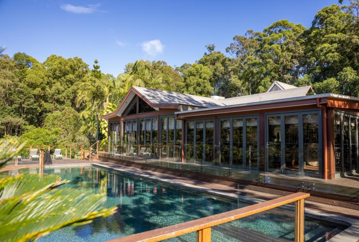 A retreat building with a large pool surrounded by rainforest, Gwinganna Lifestyle Retreat, Gold Coast, Queensland © Tourism Australia