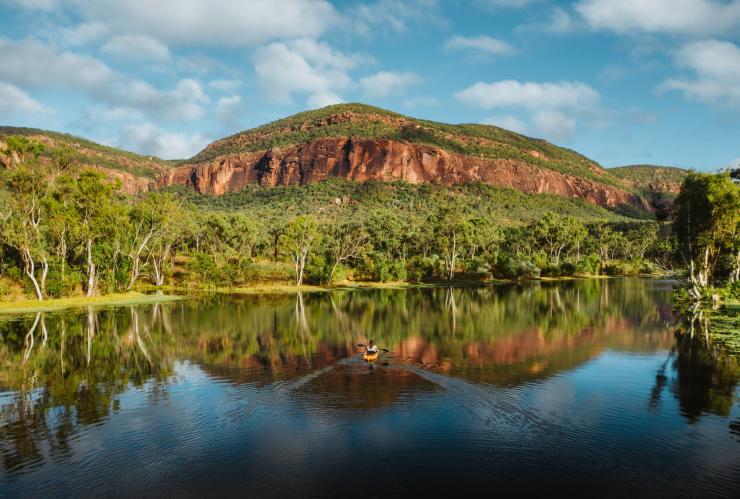A person kayaking on a still lake in an outback landscape, Mt Mulligan Lodge, Mount Mulligan, Queensland © Mt Mulligan Lodge