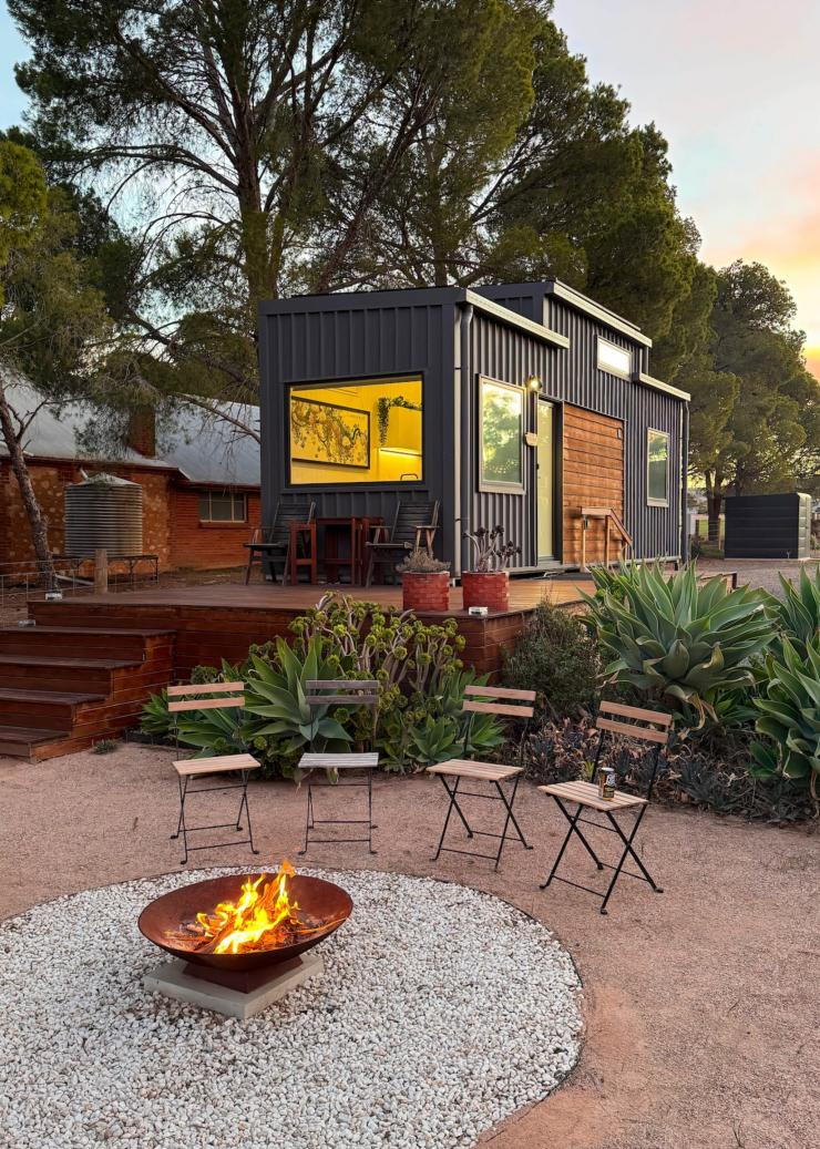 Exterior of a cabin with a balcony and a fire pit, Pink Lake Tiny House, Clare Valley, South Australia © South Australian Tourism Commission