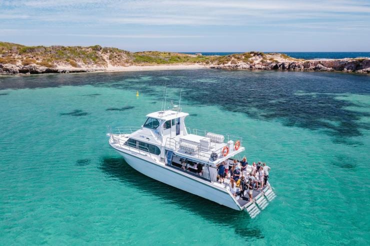 Aerial view over a group of people on a boat in clear water, Perth Wildlife Encounters, Perth, Western Australia © Tourism Australia