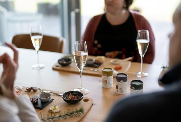 Guests enjoying platters of produce at Tasman Sea Salt, East Coast, Tasmania © Tourism Australia