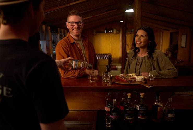 Couple having a drink at the bar at Bathurst Grange Distillery, Bathurst, New South Wales © Destination NSW