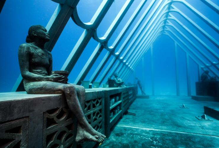 Underwater sculptures of people and structures in the Museum of Underwater Art, Townsville, Queensland © Jason DeCaires Taylor 
