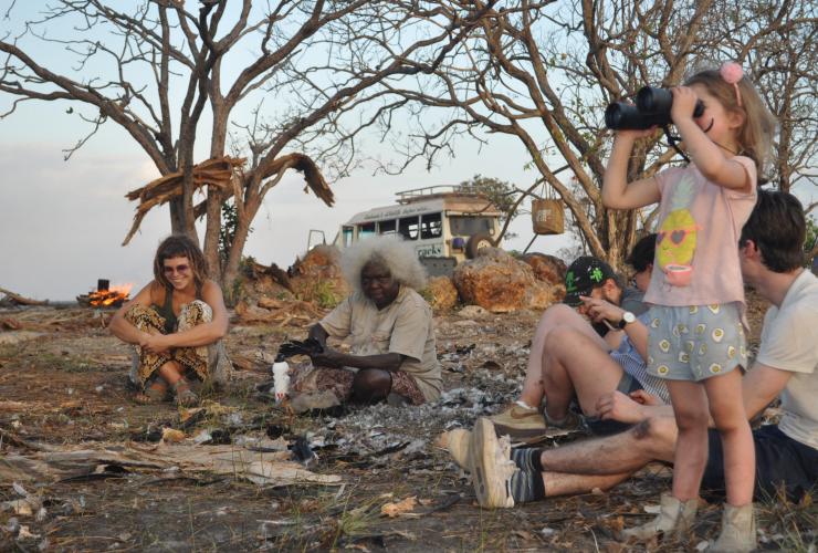 Guests sitting around the campfire with Aboriginal guide Patsy Raichiwanga Raglar, Animal Tracks, Kakadu National Park, Northern Territory © Animal Tracks 