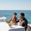 A couple dining on seafood on a boat, Rottnest Cruises, Rottnest Island, Western Australia © Tourism Australia