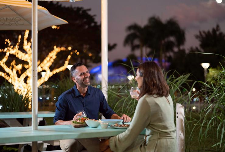 A couple dining outdoors in the evening, Snapper Rocks, Darwin, Northern Territory © Tourism NT