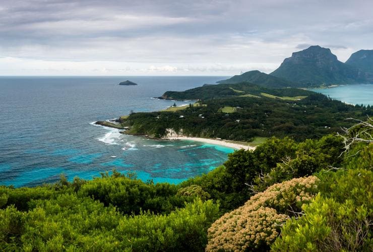 The lush green peaks, bright blue water and white sand beaches of Lord Howe Island from the top of Malabar Hill, New South Wales © James Vodicka