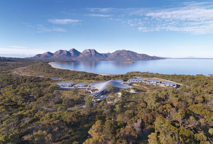 Aerial view overlooking the outstretched accommodation of Saffire Freycinet among green wilderness on the edge of Coles Bay, Freycinet, Tasmania © Saffire Freycinet
