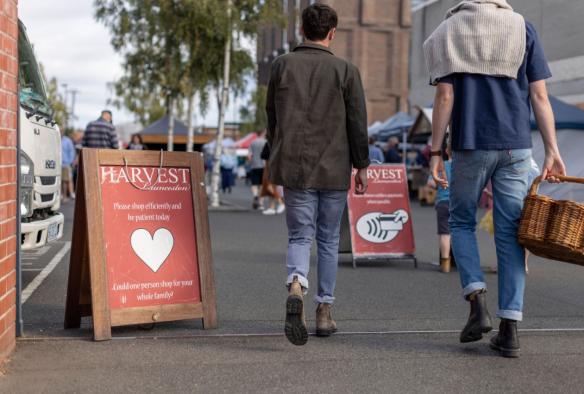 Woman ordering coffee at the Harvest Market, Launceston, Tasmania © Tourism Australia