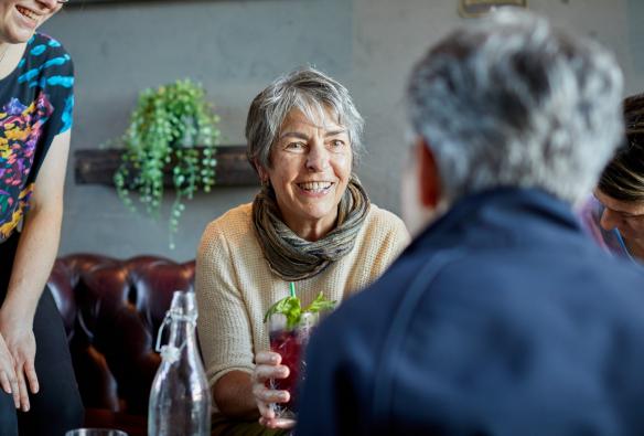 Woman smiling with cocktail, Gilbert Wines, Australia © Susan McCabe t/as Busy Blue Bus Tours