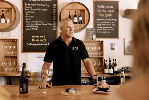 A tour guide leading a group through a tasting, Truffle Hill, Manjimup, Western Australia ©  Tourism Australia