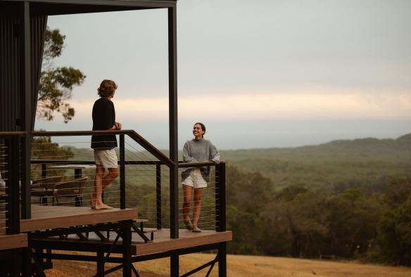 Couple on the balcony of Heyscapes Cabin, Denmark, Western Australia © Daniel Barrington & Hana Anderson