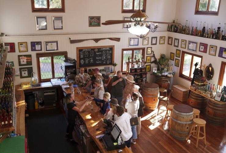 Aerial view of guests enjoying tastings on a tour with The Vino Bus at Tamborine Mountain Distillery, Brisbane, Queensland © Tourism and Events Queensland
