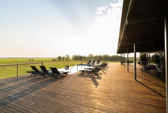 A pool deck at Finniss River Lodge, Rakula, Northern Territory © Tourism Australia