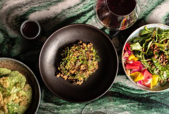 A table covered with vibrant vegetarian dishes, Monster Kitchen and Bar, Canberra, Australian Capital Territory © Ovolo Nishi