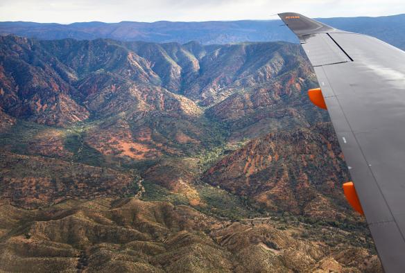 A view out of an airplane window over dramatic outback mountains, Flinders Ranges, RM Williams Tour with The Tailor, South Australia © Cormac Hanrahan
