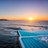 Morning sun rising over Bondi Icebergs, Bondi Beach © Destination NSW