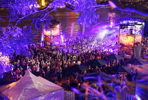 Aerial view over a crowd of people partying behind a harbour at night during the Sydney Mardi Gras, Sydney, New South Wales © Sydney Gay and Lesbian Mardi Gras 