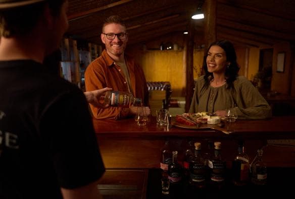 Couple having a drink at the bar at Bathurst Grange Distillery, Bathurst, New South Wales © Destination NSW