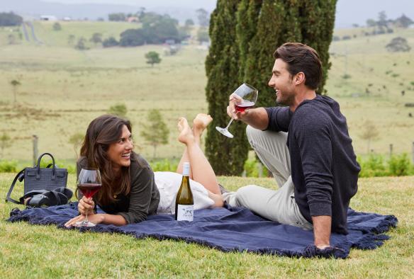 Couple enjoying wine at Cupitt's Estate, Ulladulla, New South Wales © Destination NSW