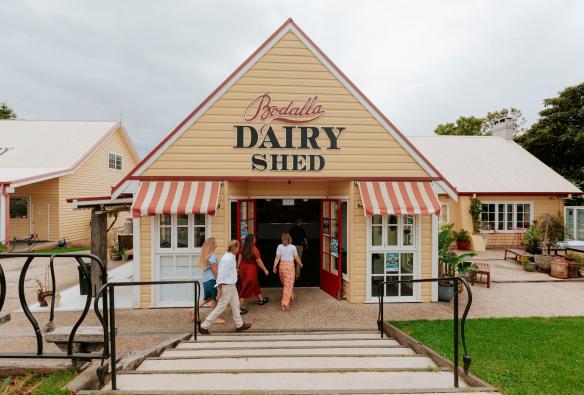 Visitors walk into a quaint, old dairy shop, Bodalla Dairy, South Coast, New South Wales © Destination NSW