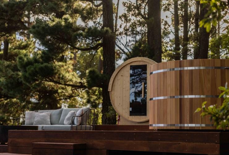 A wooden sauna on a balcony surrounded by trees Osborn House, Bundaoon, New South Wales © Osborn House 